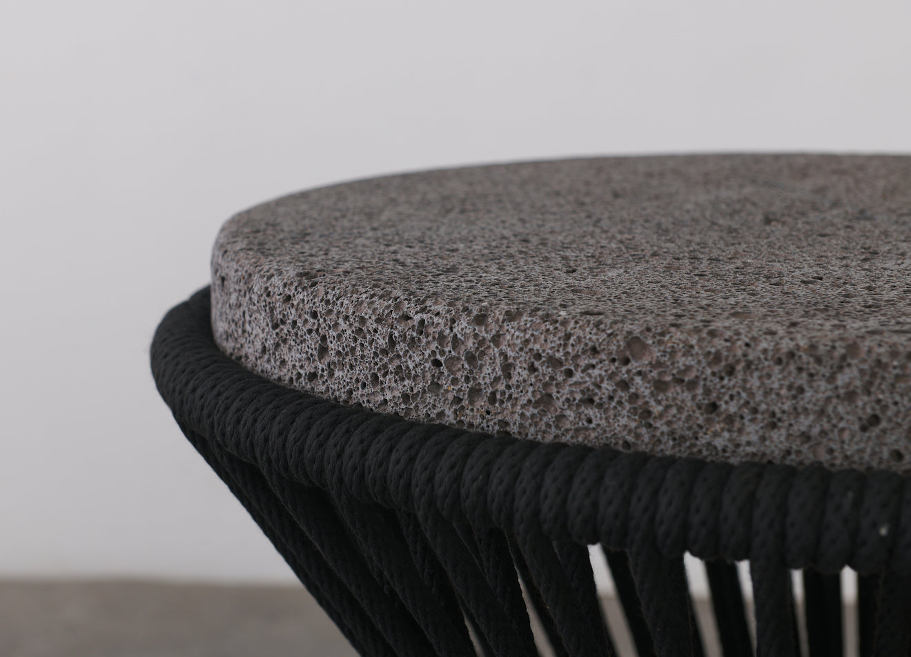 OUTDOOR ROUND TABLE WITH BASALT TOP BY LIKA MOORE